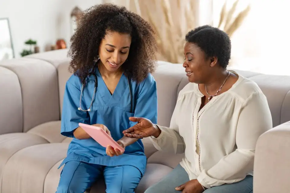 nurse-senior-black-woman-doctor-caregiver-hugging-support-love-gratitude-nursing